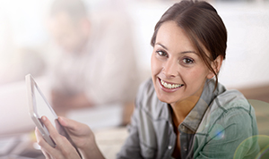 Woman smiling and looking at the camera.