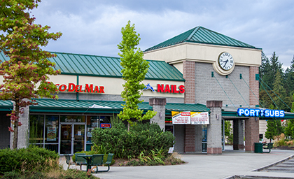 Photograph taken in front of Quil Ceda Village showing multiple storefronts.